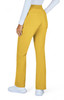 A pair of yellow pants with a flared design, featuring back pockets, displayed on a model wearing a white top.