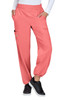 Coral cargo pants featuring pockets and an elastic waistband, worn with a white top and black sneakers.