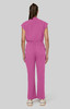 A pink jumpsuit with short sleeves and a relaxed fit, featuring a belt around the waist and flared legs.