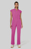 A jumpsuit in bright pink with a collared neckline and pockets, featuring a fitted silhouette and short sleeves.