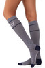 Compression socks in grey with navy detailing, featuring a logo. Designed to reach just below the knee.