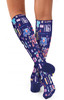 A pair of navy compression socks decorated with colourful patterns of medical-themed illustrations.
