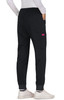 Black Aster Pants with an elastic waistband and a single pocket, styled with fitted cuffs and worn with white shoes.