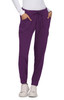 A pair of purple pants with pockets and a drawstring waistband, worn with a fitted white top and shoes.