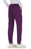 A pair of purple Aster Pants with an elastic waistband and side pockets, worn with white shoes.