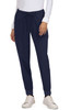 Navy Aster Pants with a drawstring waist and pockets, paired with a white top and casual shoes.