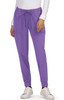 A pair of purple Aster Pants with a drawstring waist and side pockets, worn with white sneakers.