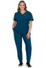 A model wearing a teal scrub set consisting of a V-neck top and tapered pants, with a logo on the top.
