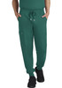 A pair of green jogger pants featuring pockets and an elastic waistband, worn by a person standing casually.