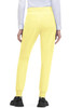 A pair of yellow joggers with pockets, featuring tapered legs and elastic cuffs, worn with a light-coloured top.