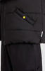 A black puffer vest with a side pocket and a yellow button detail, featuring a zip closure on one side.