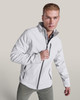 A softshell jacket in white with a zip closure and side pockets, featuring a logo on the chest.