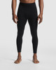 A pair of black leggings designed for men, featured on a model standing barefoot. The product has a logo detail.