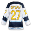 A custom hockey jersey in white, navy, and blue with a yellow name and number design. It features a logo.
