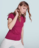 A fitted maroon T-shirt worn by a model with long hair, styled in a casual pose. The background is light blue.