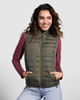 A woman models an olive green padded vest, featuring a zip front and side pockets, paired with a burgundy long-sleeve top.