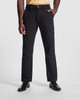 Black patrol work trousers displayed on a model, featuring a sleek design and a button closure.