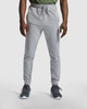 Grey track pants with an elastic waistband and side pockets, featuring an emblem on the hip.