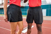 Black ladies' running shorts with a sleek design, featuring a logo on the side. Suitable for sports activities.