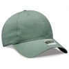 A green 6-panel low profile dad cap with a curved brim and a logo label on the front.