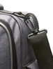 A grey bag featuring a black adjustable strap and a black clip attachment. Includes a logo on the side.