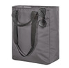 A grey tote bag with black handles, featuring a pair of sunglasses resting on top. The bag has a logo.