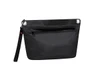 A black Drybag Zipper Bag featuring a front zip pocket and a wrist strap. It has a branding logo.