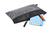 A black and grey zippered bag containing a blue notebook and a pencil, featuring a small logo.