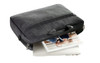 A grey laptop bag with a handle, partially unzipped to reveal a laptop and a notebook inside.