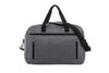 A grey fashion travel bag with two front zippered pockets and dual handles, featuring a detachable shoulder strap.