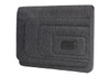 A grey laptop bag with a textured design and a black logo on the front.