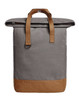 A grey backpack with a fold-over top and tan leather accents. It features dual straps and a side pocket.