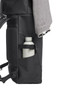 A black backpack featuring a side pocket with a drink bottle and a sweater draped over the top.