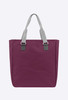 A reusable grocery bag in a deep plum colour with grey handles and a simple design, featuring a logo.