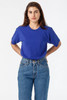 A blue short sleeve fine jersey crew tee displayed on a model, paired with high-waisted jeans.