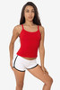 A red spaghetti tank top worn with white shorts, featuring adjustable straps and a fitted design.