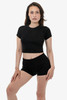 A black short sleeve ribbed tee paired with black shorts, modelled by a female. The top has a fitted design.