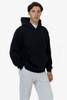 A heavy fleece hood pullover in navy blue, worn by a model, featuring a front pocket and a hood.