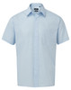 A light blue short-sleeve button-up shirt with a collar and a single chest pocket. It features a logo on the label.