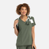 A mock wrap top in olive green, featuring a V-neck and fitted design, with a stethoscope around the model's neck.