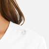 A white women's mock wrap top featuring a loop detail on the shoulder.