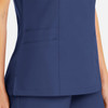 A women's mock wrap top in navy blue with side pockets, featuring a sleek and modern design.