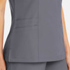 A grey women's mock wrap top featuring pockets and a sleek design, with a logo on the fabric.