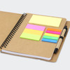 A Kraft notebook featuring a spiral binding, assorted sticky notes in bright colours, and a pen holder.