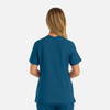 A women's double V-neck top in a teal colour, featuring short sleeves and a relaxed fit. It has a logo on the garment.