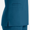 A side view of a teal women's double V-neck top featuring pockets and a sleek design.