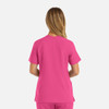 A pink women's double V-neck top with short sleeves and a sleek design, featuring a logo on the back.