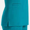 A teal women's double v-neck top featuring a side slit and a pocket. The fabric appears smooth and lightweight.
