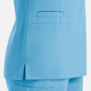 A blue women's top with a double V-neck design and side slits, featuring two pockets on the side.