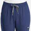 A pair of navy women's full elastic pull-on pants featuring side pockets and a drawstring waistband.